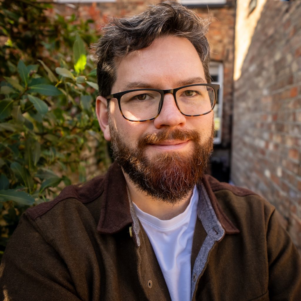 White male, Steve Morgan, with beard and glasses, handsome with lovely brown hair and kind eyes